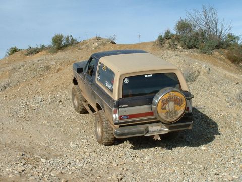 1991 Ford Bronco - This 1991 Ford Bronco is shown from the rear on a rocky, off-road trail.