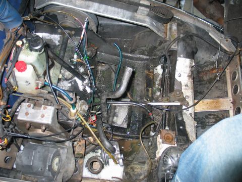 1990 Ford Mustang - The engine compartment of a snowmobile, showing various mechanical components and wiring.