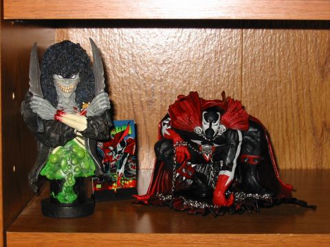 1991 Ford Bronco - Spawn figures displayed on a shelf, with a comic book visible between them.