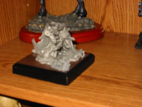 1991 Ford Bronco - A detailed figurine is displayed on a shelf, with other collectibles visible.
