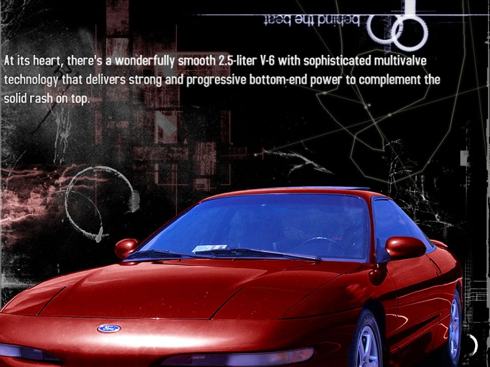 Red coupe front 3/4 view. Ford badge visible