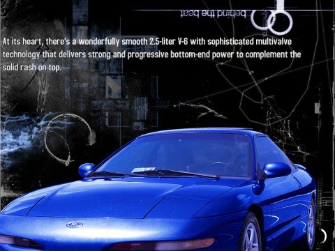2000 Ford Mustang - This blue coupe's body style suggests a 1990s model, not a 2000 Ford Mustang.
