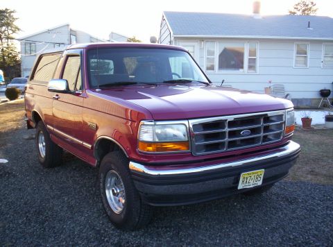 1995 Ford Bronco - This 1995 Ford Bronco is seen in a driveway with a house in the background.