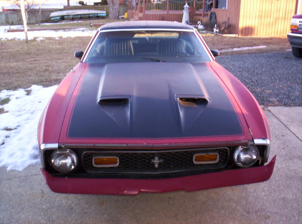 1971 Ford Mustang front view with black hood scoop and red body