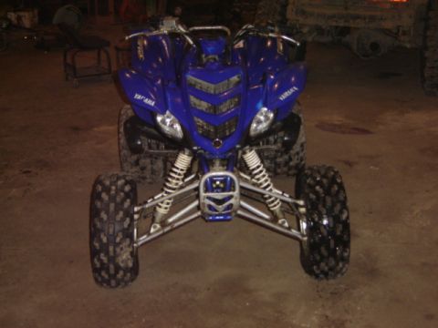 1992 Ford Bronco - Front view of a blue Yamaha ATV with knobby tires and suspension visible.