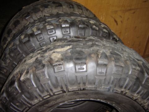 1992 Ford Bronco - These tires are for sale and appear to be used off-road tires.