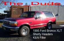 1993 Ford Bronco - A red 1995 Ford Bronco XLT is shown from a three-quarter front angle.