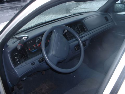 1999 Ford Crown Victoria - Interior view of a 1999 Ford Crown Victoria, highlighting the dashboard and driver's area.