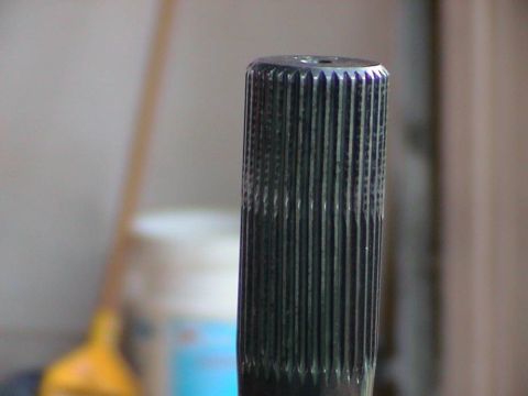 1979 Ford Bronco - A close-up shot of a splined shaft, likely a vehicle part, with a hole at the top end.