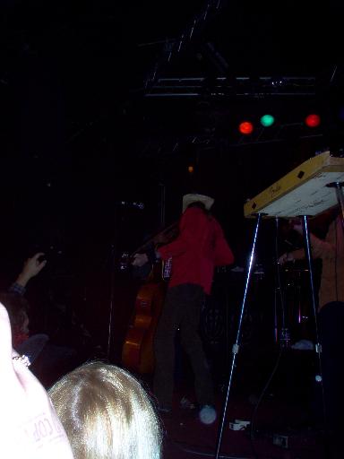 1988 Ford Bronco - Musicians perform on stage with instruments and stage lighting visible.