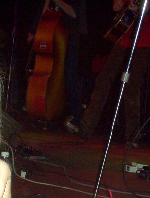 1988 Ford Bronco - Musicians perform on a dimly lit stage with various instruments and equipment.
