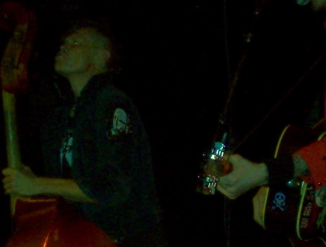 1988 Ford Bronco - Musicians perform on stage, illuminated by stage lights, with instruments in hand.