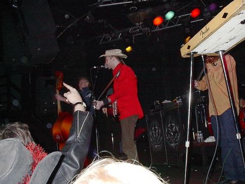 1988 Ford Bronco - A band performs live on stage with various instruments and stage lighting.