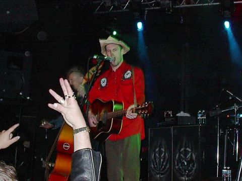 1988 Ford Bronco - Live music performance with a guitarist in a cowboy hat and a bassist on stage.