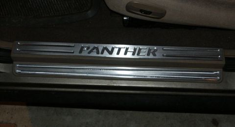 2001 Mercury Grand Marquis - Door sill plate with "PANTHER" lettering, likely an aftermarket accessory.