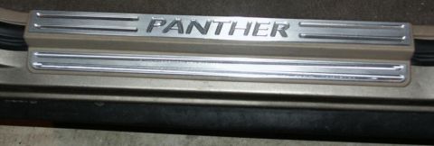 2001 Mercury Grand Marquis - Door sill plate with "PANTHER" text, likely an aftermarket accessory.