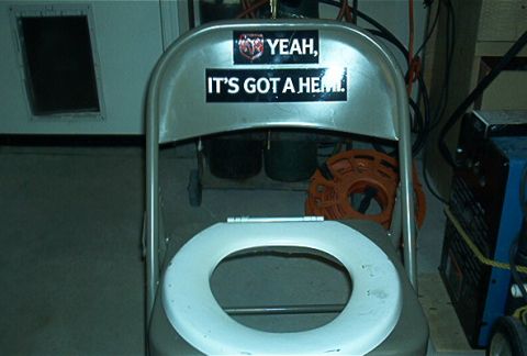 1986 Ford Bronco - A humorous modification to a folding chair, automotive-themed stickers.