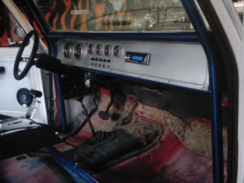 1978 Ford Bronco - Custom dashboard in a 1978 Ford Bronco features multiple gauges and a modern radio unit.