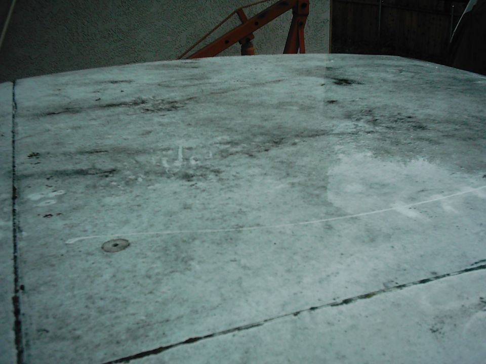 Vehicle roof with water stains and a visible seam