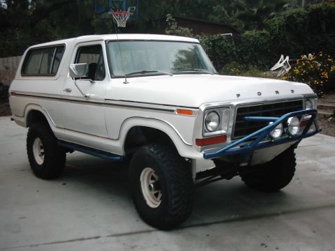 1978 Ford Bronco - This lifted Ford Bronco features a custom blue front bumper with auxiliary lights and side steps.