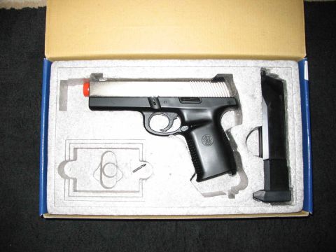 1996 Ford Taurus - A pistol and its magazine are packaged in a box with custom foam padding.