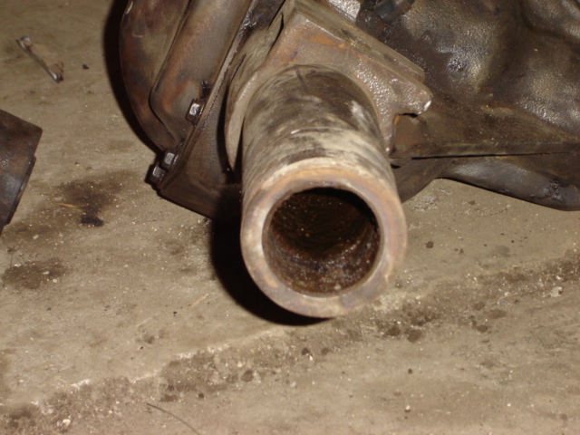 Close-up of a rusty metal tube extending from a differential housing