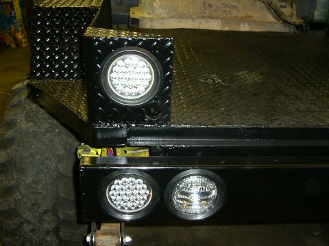 1990 Ford Bronco - Custom truck bed features diamond plate storage boxes and bright LED lights.