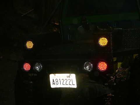 1990 Ford Bronco - Rear view of a truck showing aftermarket LED lights and a license plate.