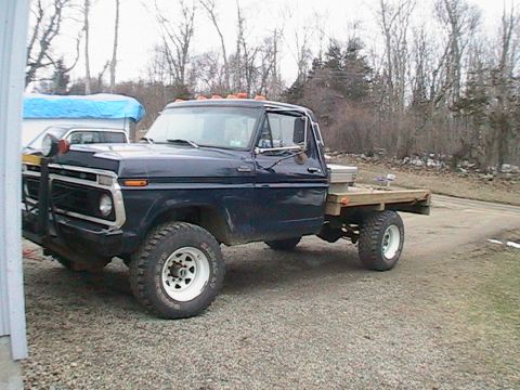 1977 Ford F-250 - This 1977 Ford F-250 features a flatbed and a prominent grille.