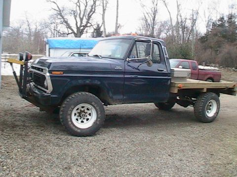 1977 Ford F-250 - This 1977 Ford F-250 flatbed truck is equipped with a heavy-duty push bumper and auxiliary lighting.