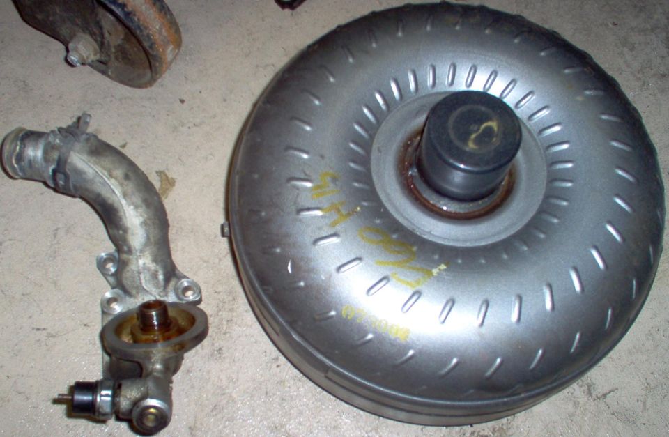 Oil filter adapter.

SOLD New torque converter with ~1000 miles.