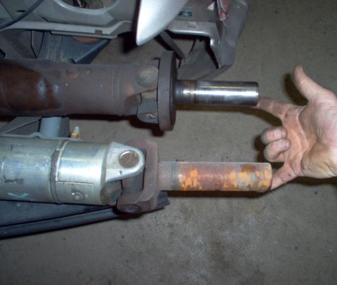1994 Ford Crown Victoria - The upper steel driveshaft is slightly longer than the aluminum one, but the aluminum's yoke makes it longer overall.