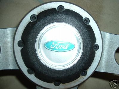 1973 Ford Ranchero - Close-up of a Ford steering wheel hub with the iconic blue oval logo.