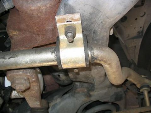 1999 Ford Crown Victoria - Underside view of a vehicle's sway bar and suspension components.