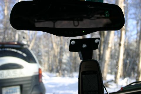 2003 Jeep TJ - View from inside a vehicle, showing a GPS unit and another vehicle in a snowy wooded area.