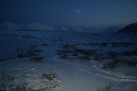 2003 Jeep TJ - Winter scene with snow-covered ground and mountains under a twilight sky.