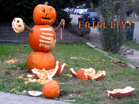 1990 Ford Bronco - A Halloween decoration made of pumpkins, with the word 'FATALITY!' superimposed and cars visible in the background.