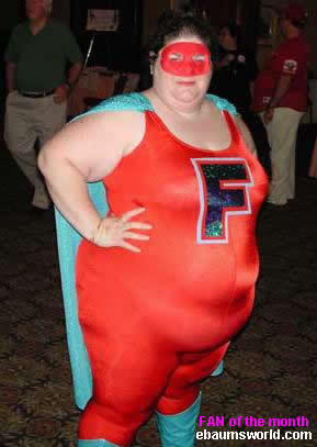 1990 Ford Bronco - A person poses in a superhero costume, complete with a cape and a mask.