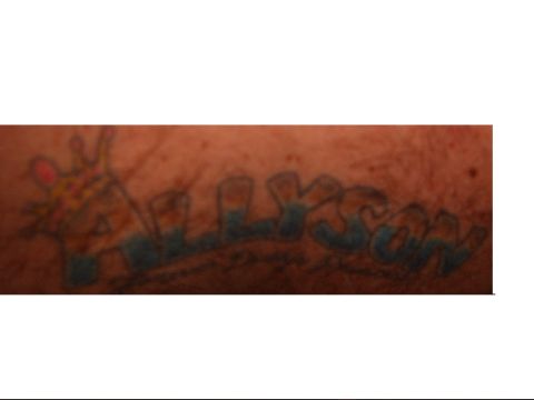 1993 Ford Bronco - Tattoo of the name Allyson and a cartoon giraffe on skin.