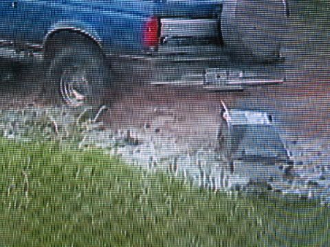1996 Ford Bronco - This 1996 Ford Bronco is seen from the side, a blue exterior and a large tire.