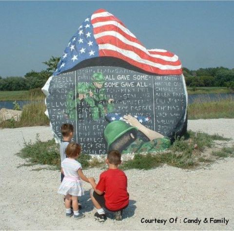1991 Ford Bronco - Memorial stone lists names of soldiers; painting depicts a fallen soldier under the American flag.