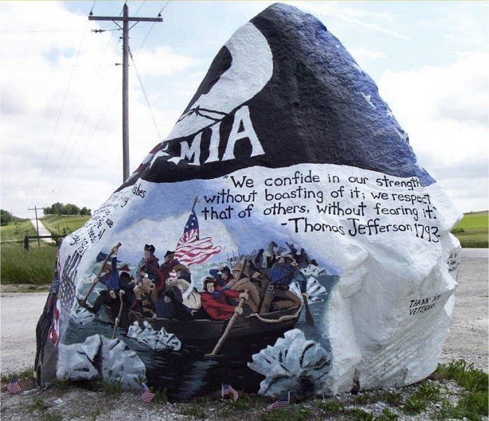 Painted rock shows Washington crossing the Delaware, MIA text, and a Thomas Jefferson quote