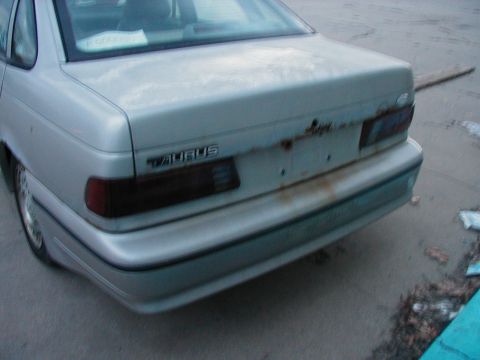 1997 Ford Taurus - 1997 Ford Taurus rear view showing the trunk lid and taillights.