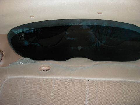 1997 Ford Taurus - Interior view showing the rear window and upholstered seats.