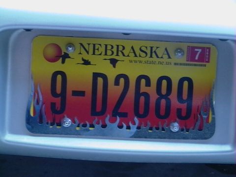 1999 Ford Taurus - A Nebraska license plate with a flame design and the number 9-D2689 is visible, along with a 2009 sticker.