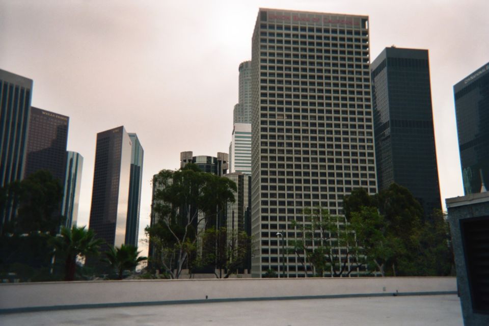 Downtown skyscrapers including a tall dark tower under an overcast sky