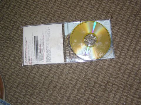 1997 Ford Probe - CD jewel case with booklet and disc labeled NORMA JEAN, resting on carpet.