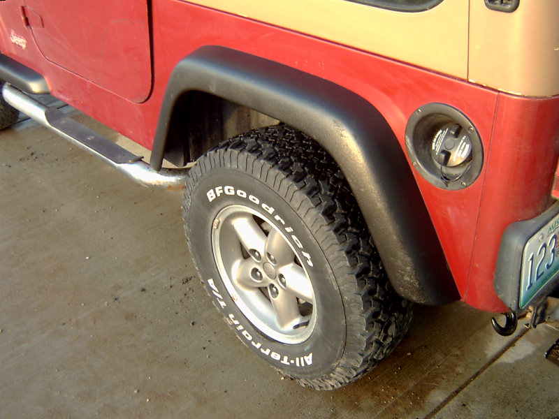 Jeep TJ rear quarter panel, fuel door, and tire with BFGoodrich All-Terrain T/A text