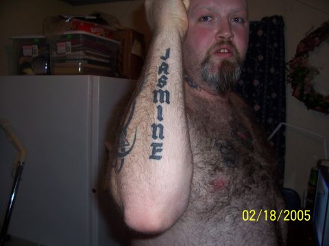 1989 Ford Bronco - Man with tattoos on arm and chest, dated February 18, 2005.