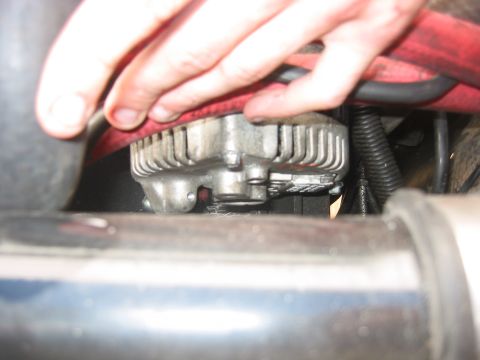 1989 Ford Bronco - Close-up view of an alternator, likely part of an engine bay modification.